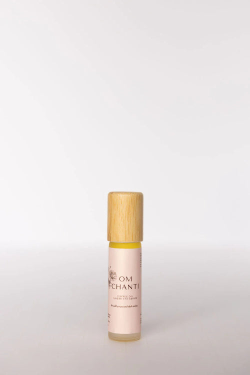 Skincare bottle with wooden cap on a light gray background
