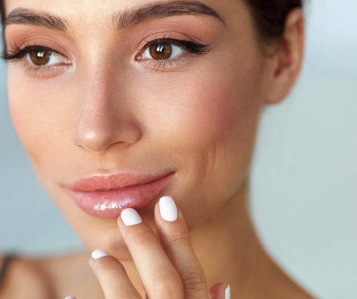 Close-up of a woman's face with a neutral background