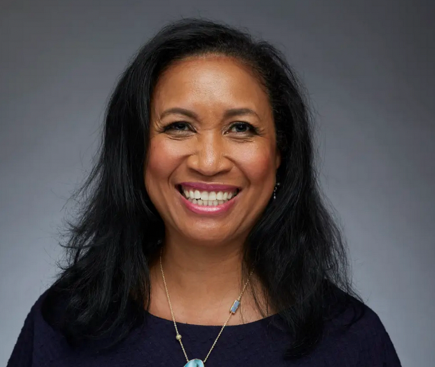 Lorrie against a gray background