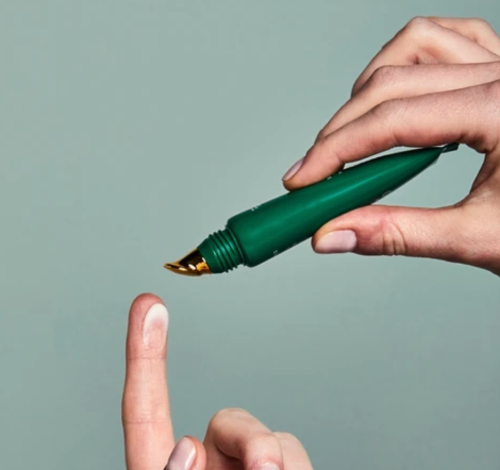 ORVOS eye cream applied onto finger