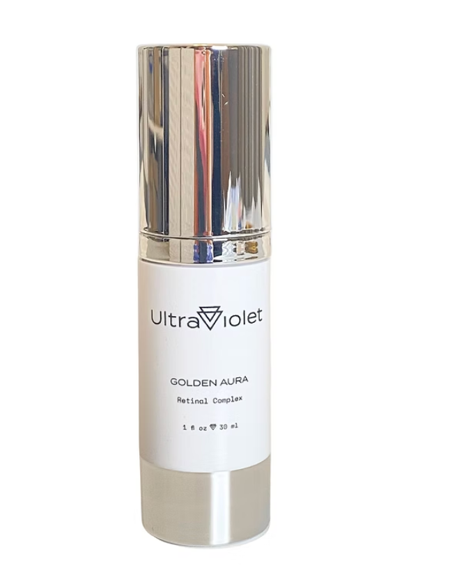 UltraViolet Golden Aura Retinol Complex in a white and silver cylindrical bottle with a reflective metallic cap, shown against a plain white background.