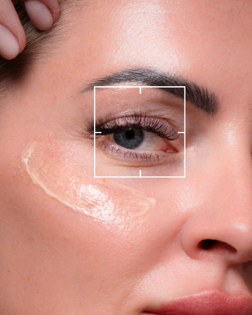 Close-up of a woman's eye with a white rectangular border