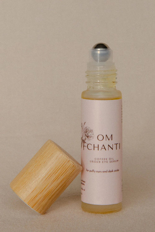 Roll-up bottle with wooden cap on a beige background